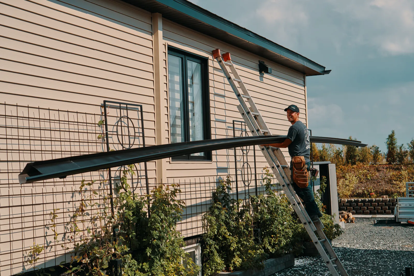 Seamless gutter installation from the ladder — Gutters R US Enterprises, Cowichan Valley BC